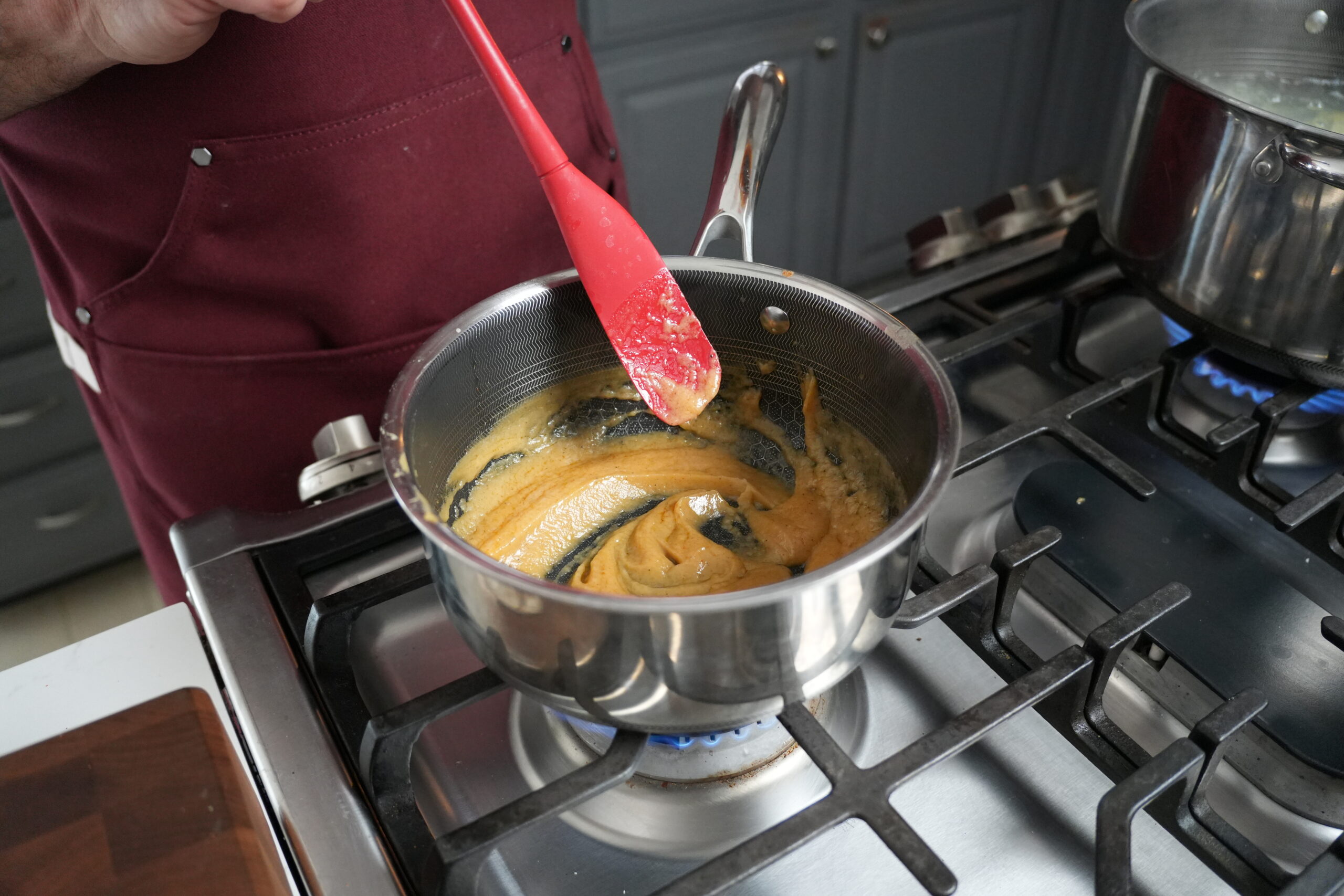 Turkey gravy in a stock pot.