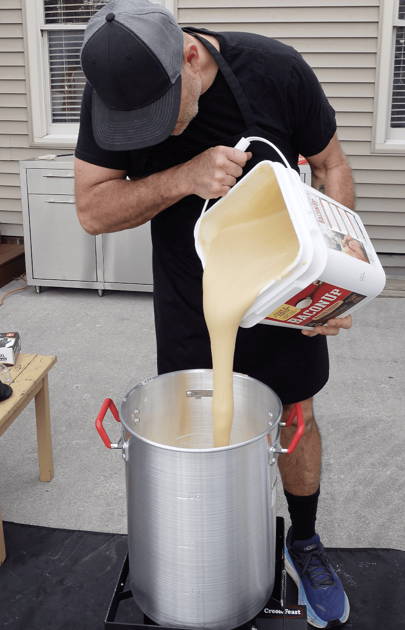 Bacon grease going into fryer.