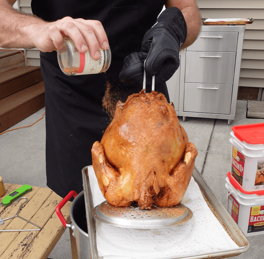 Seasoning turkey outside.