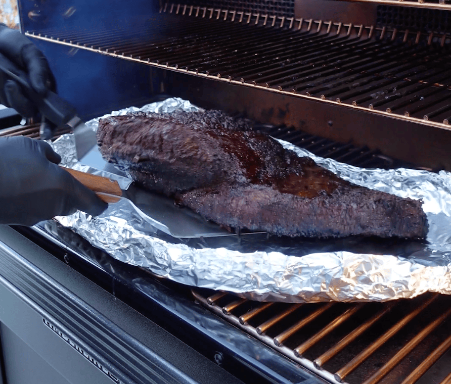 Brisket going on aluminum foil.