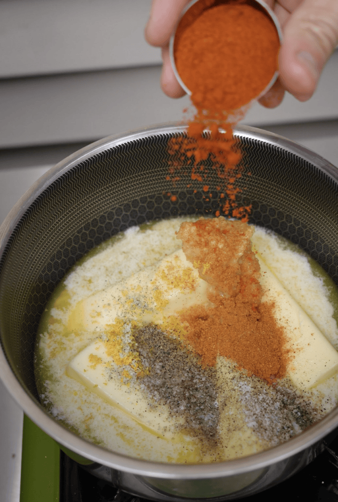 Cayenne Pepper going into butter sauce.