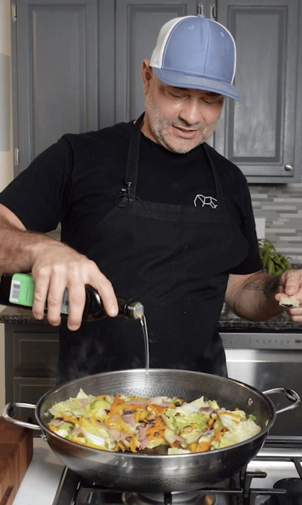 Olive oil over vegetables.