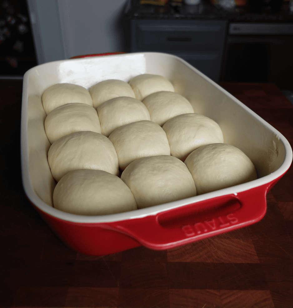 Dough balls in a baking dish.