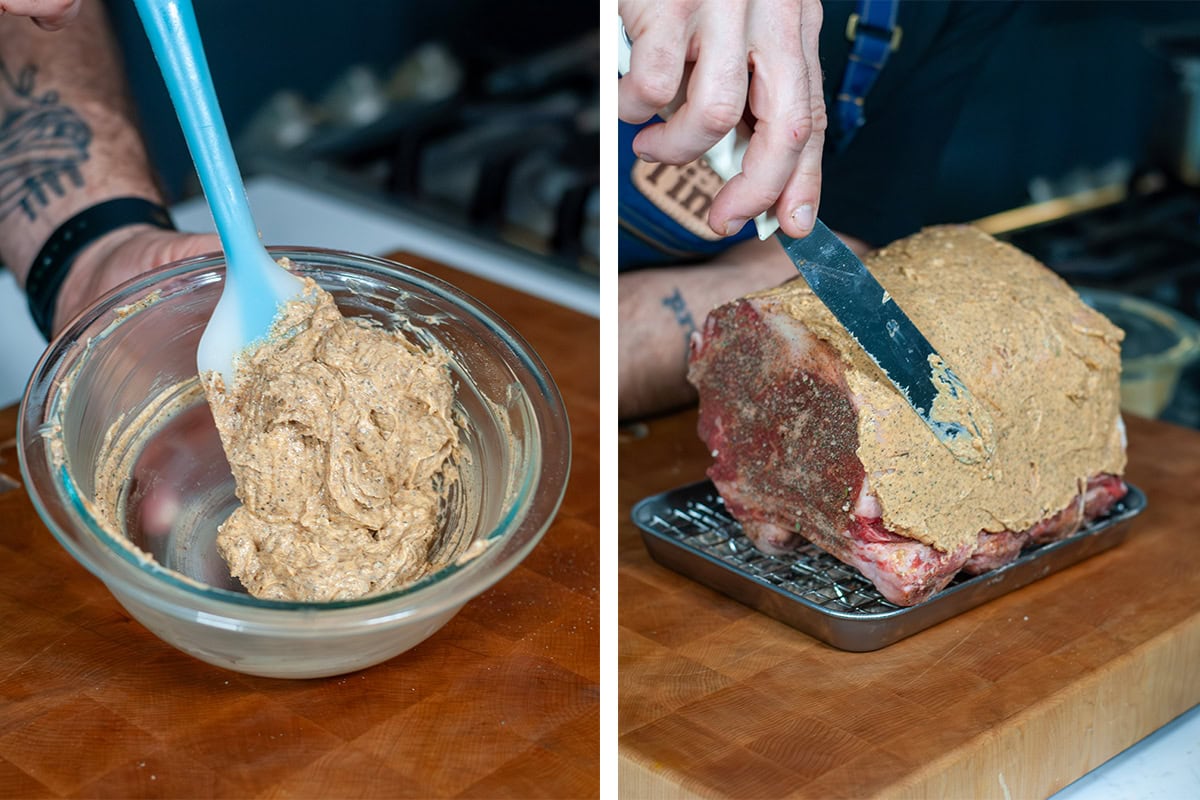 Coating a rib roast with seasoning butter.