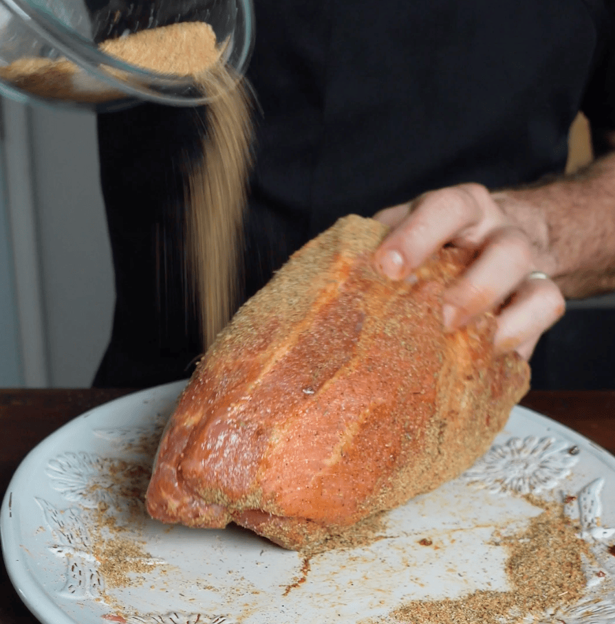 Seasoning pork roast.