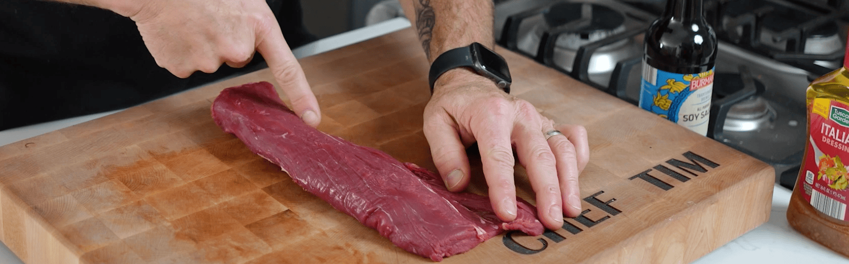 Trimming venison with knife.