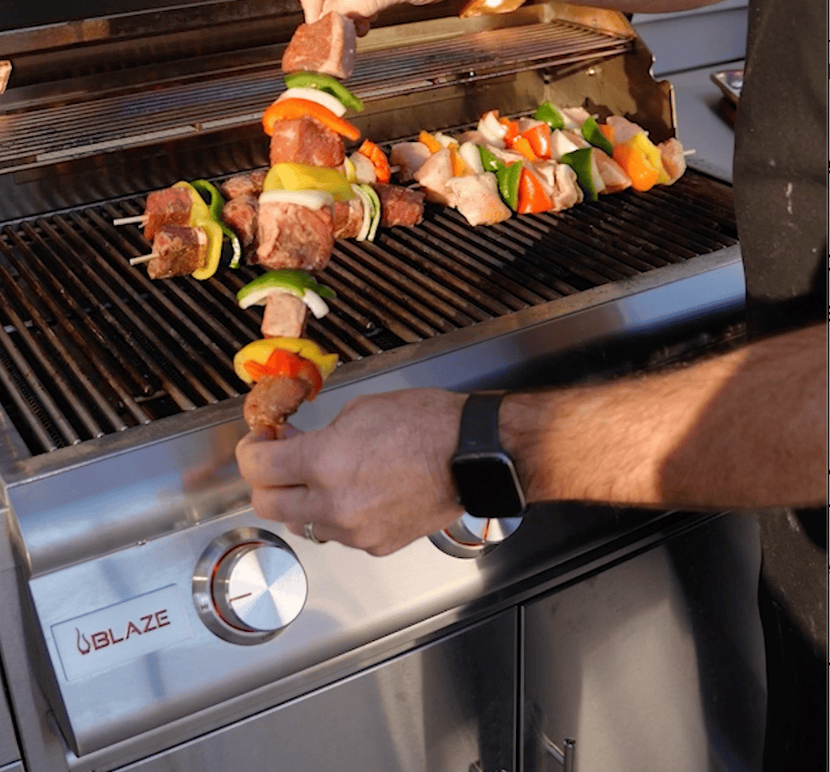 Skewers with meat on a grill.