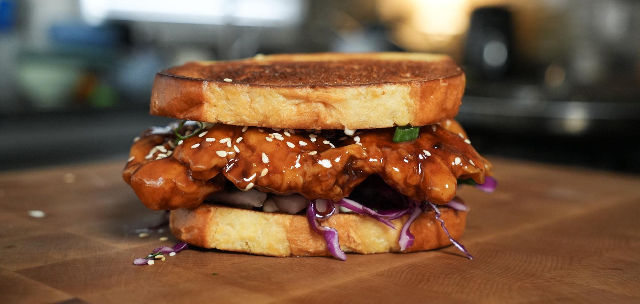 Orange chicken sandwich on toast.