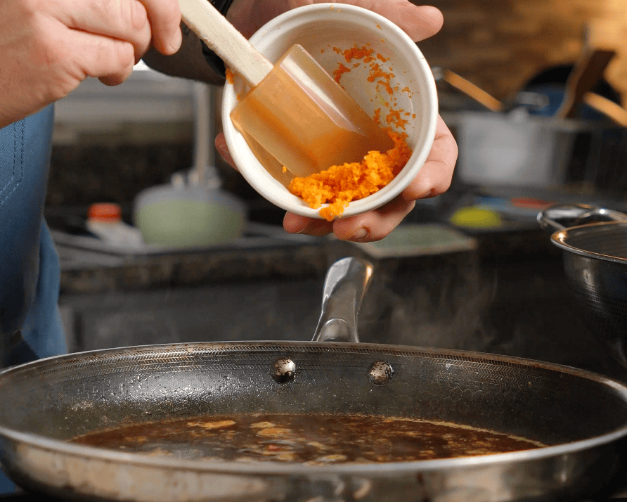 Orange zest in a skillet.