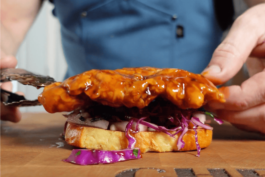 Orange chicken on a slice of bread.