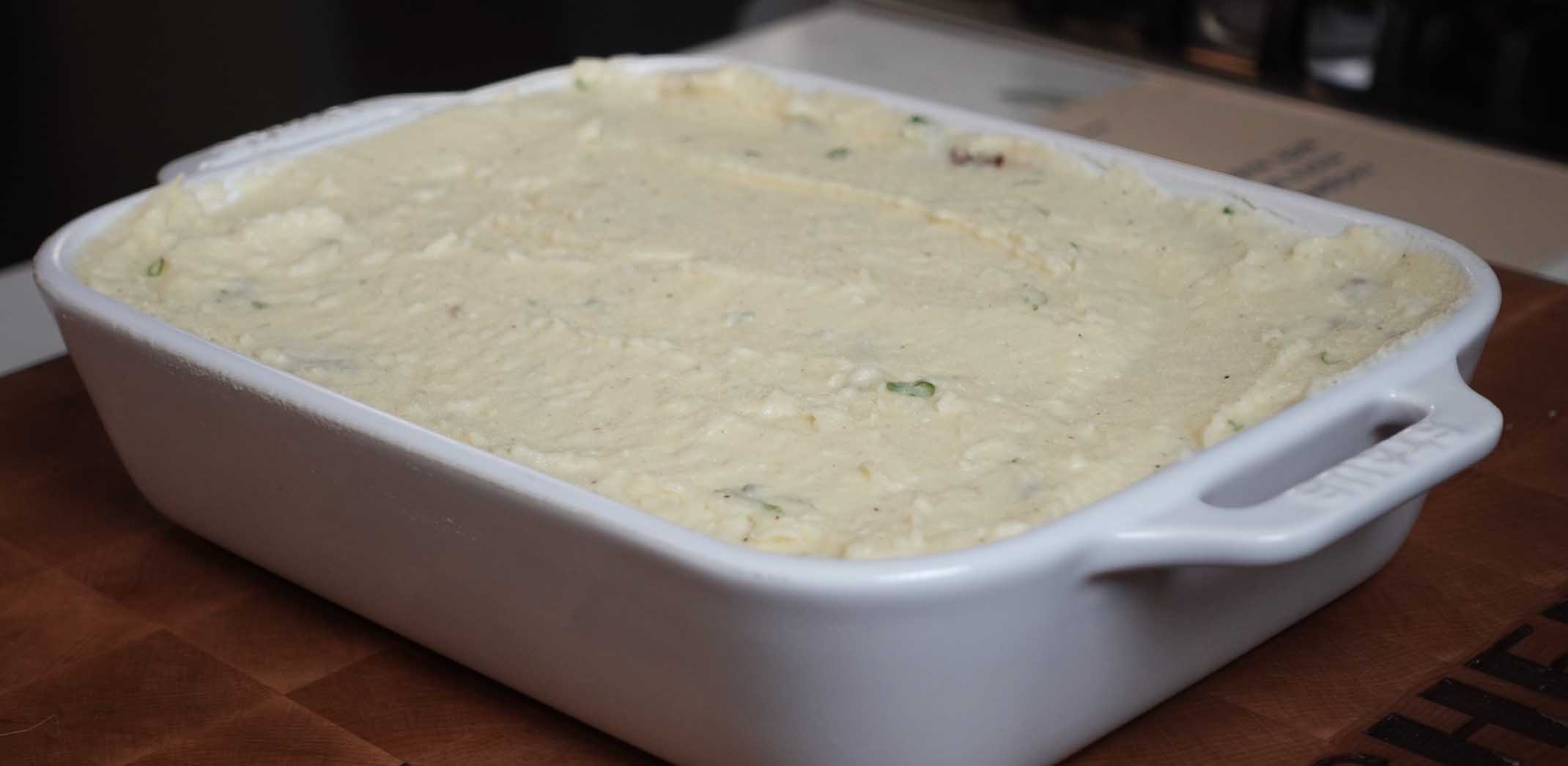 Spread potatoes on a baking dish.