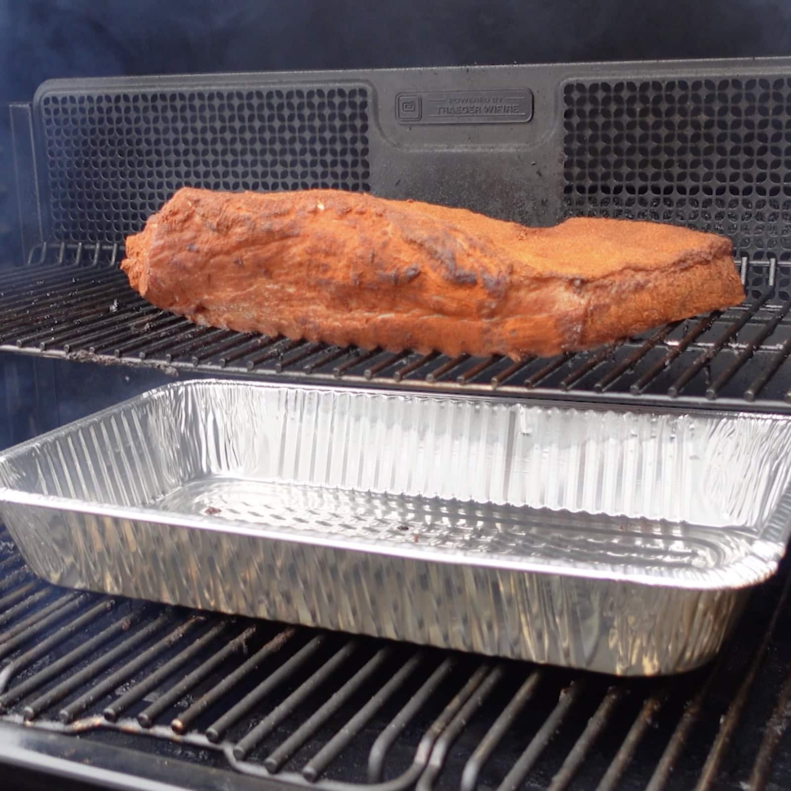 Brisket sitting on the smoker.