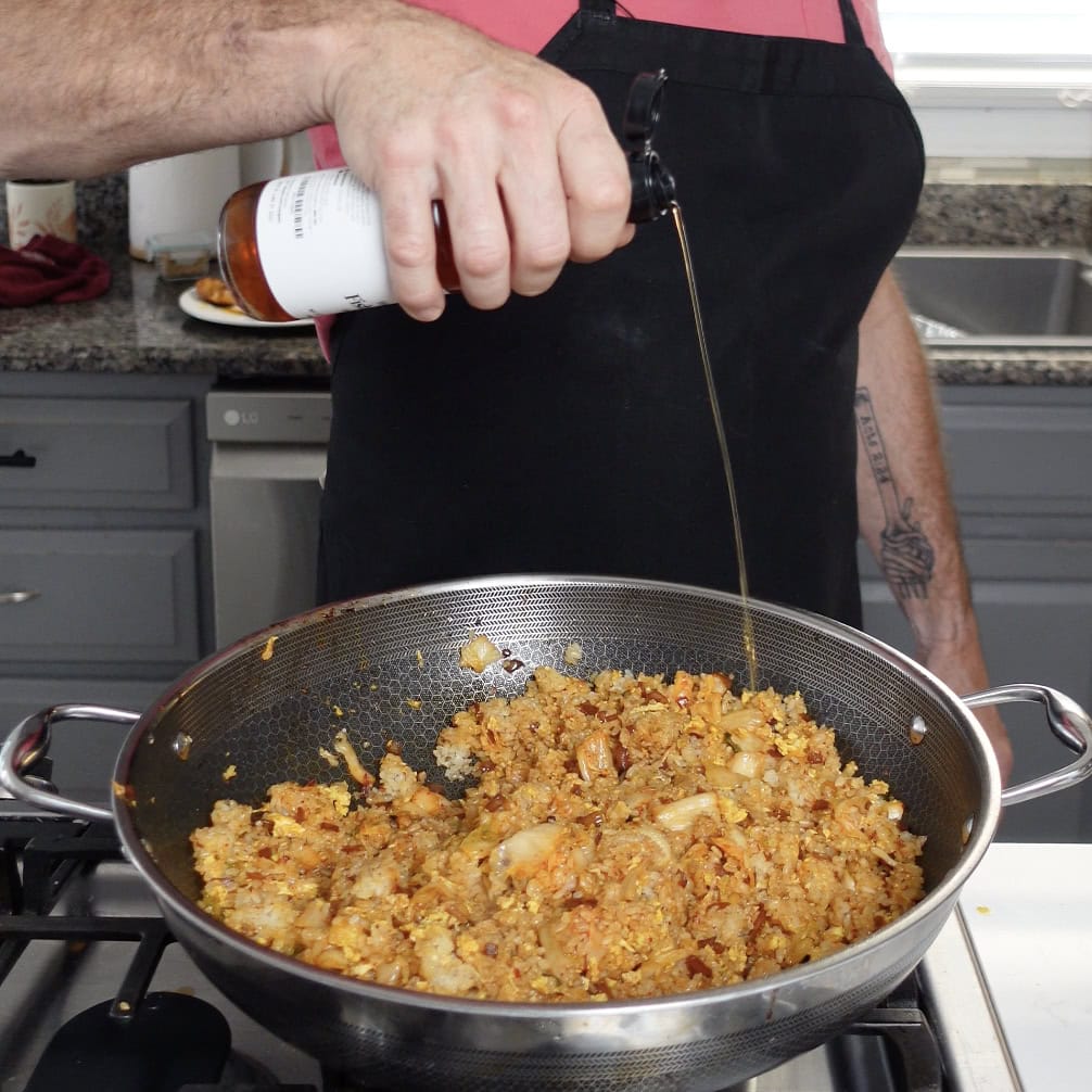 A plate of fried rice with pork.