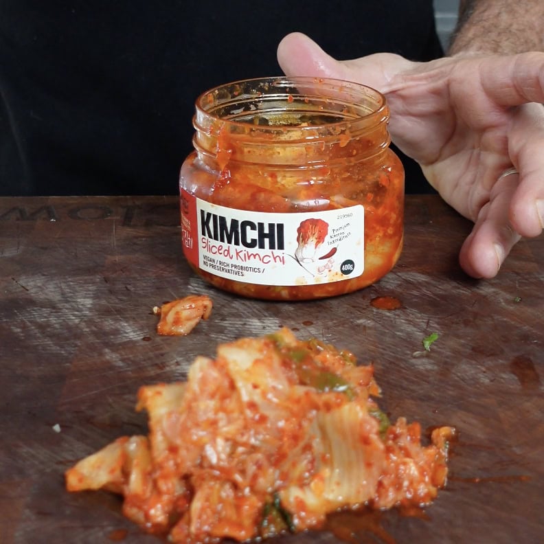 Kimchi on a cutting board.