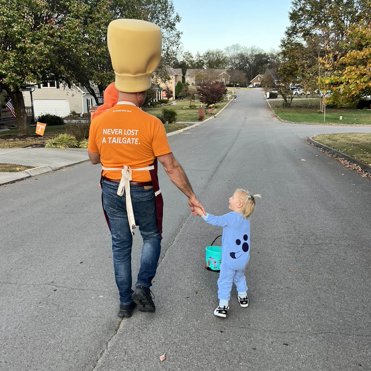 Tim walking with this two granddaughters at halloween