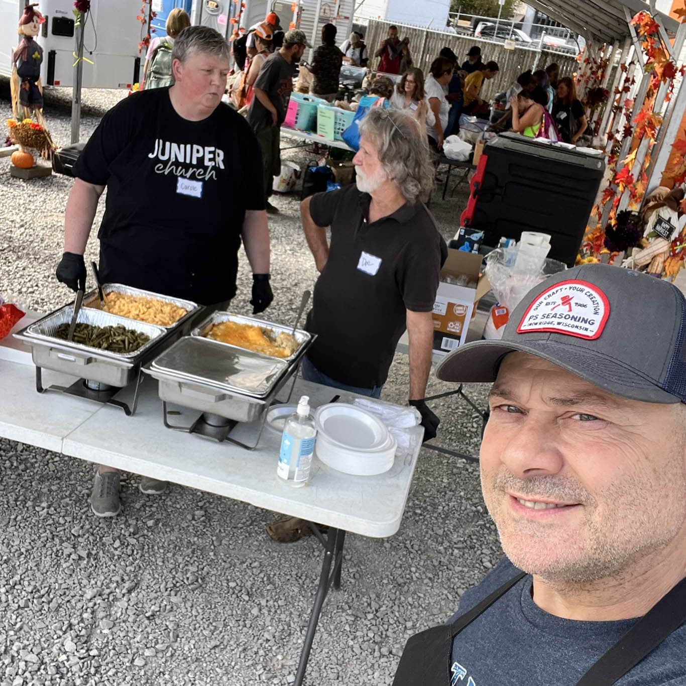 People helping at the homeless outreach for Juniper Worldwide
