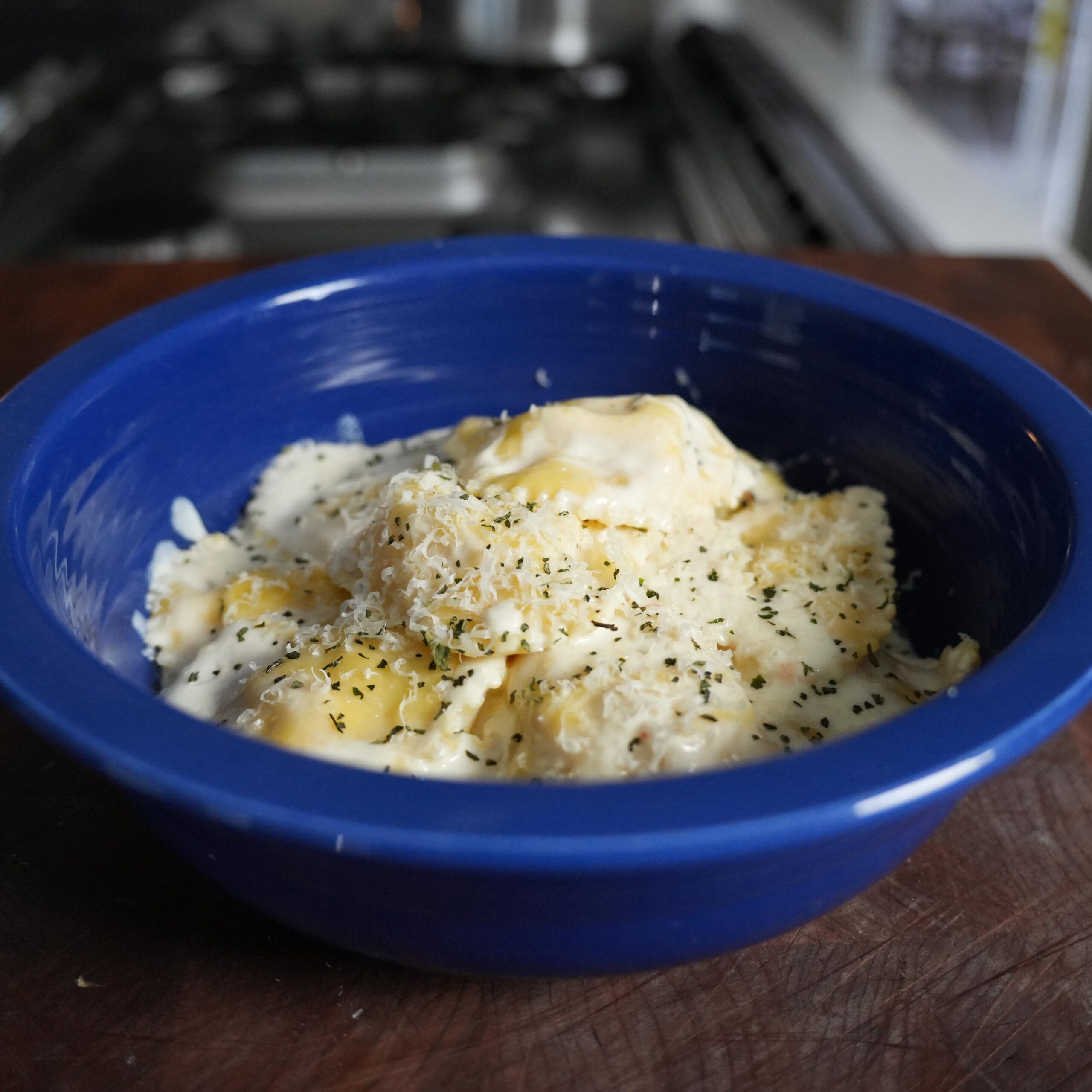 Lobster ravioli topped with parmesan cheese.