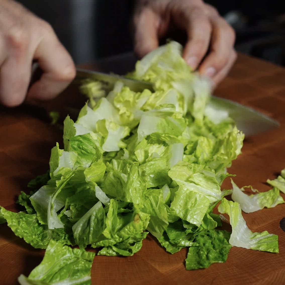 Chopping romaine lettuce.