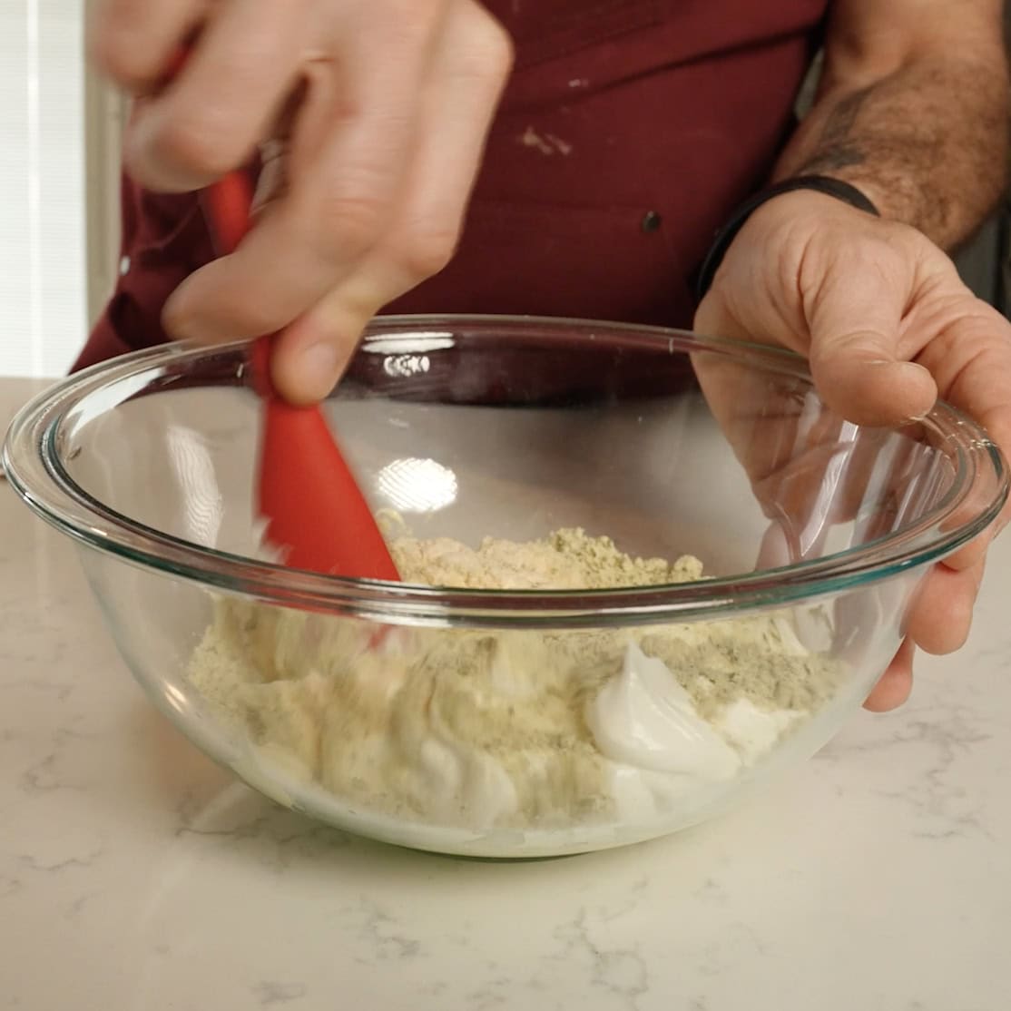 Mixing sour cream and ranch for Jalapeno Ranch Crack Dip