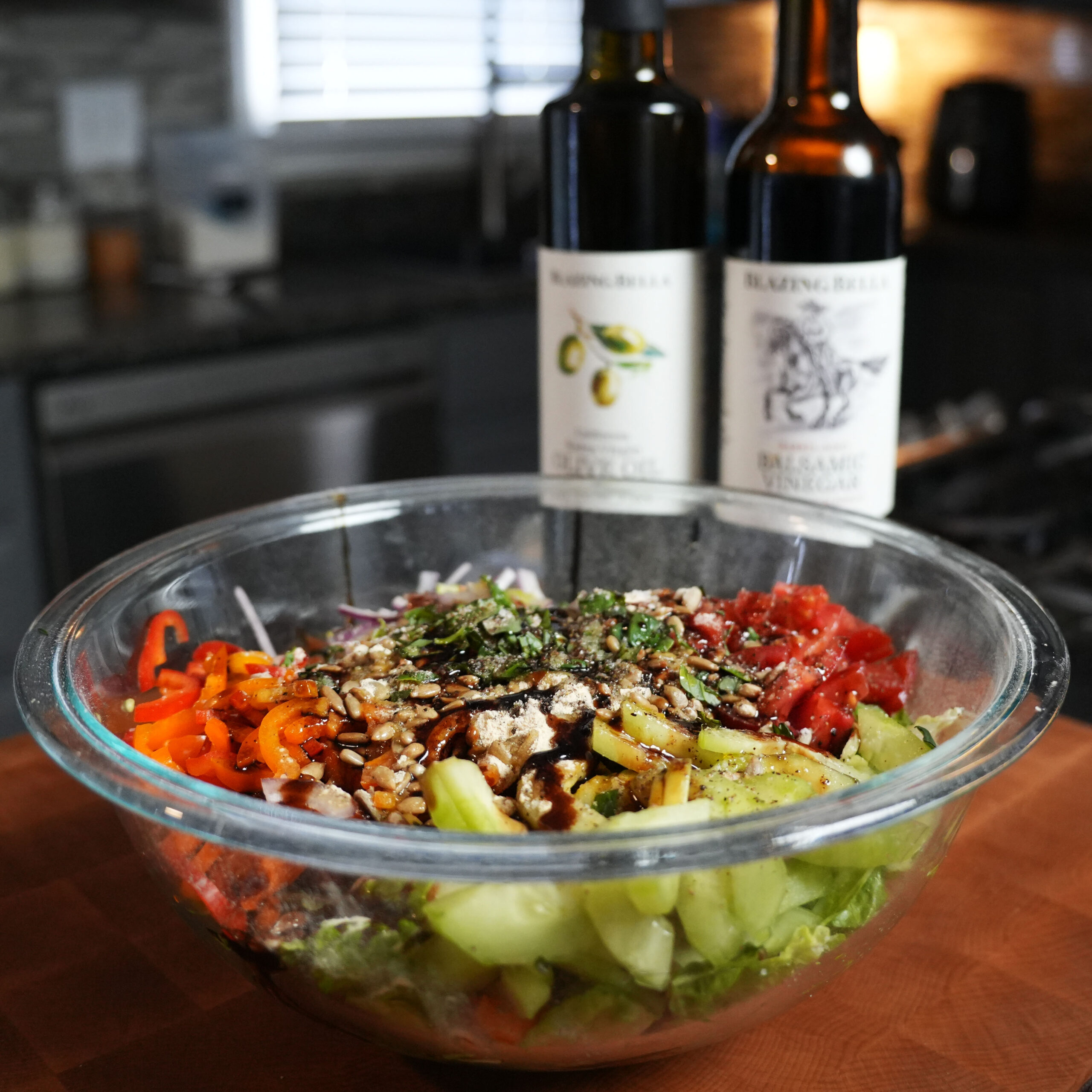 A salad with vegetables and balsamic dressing.