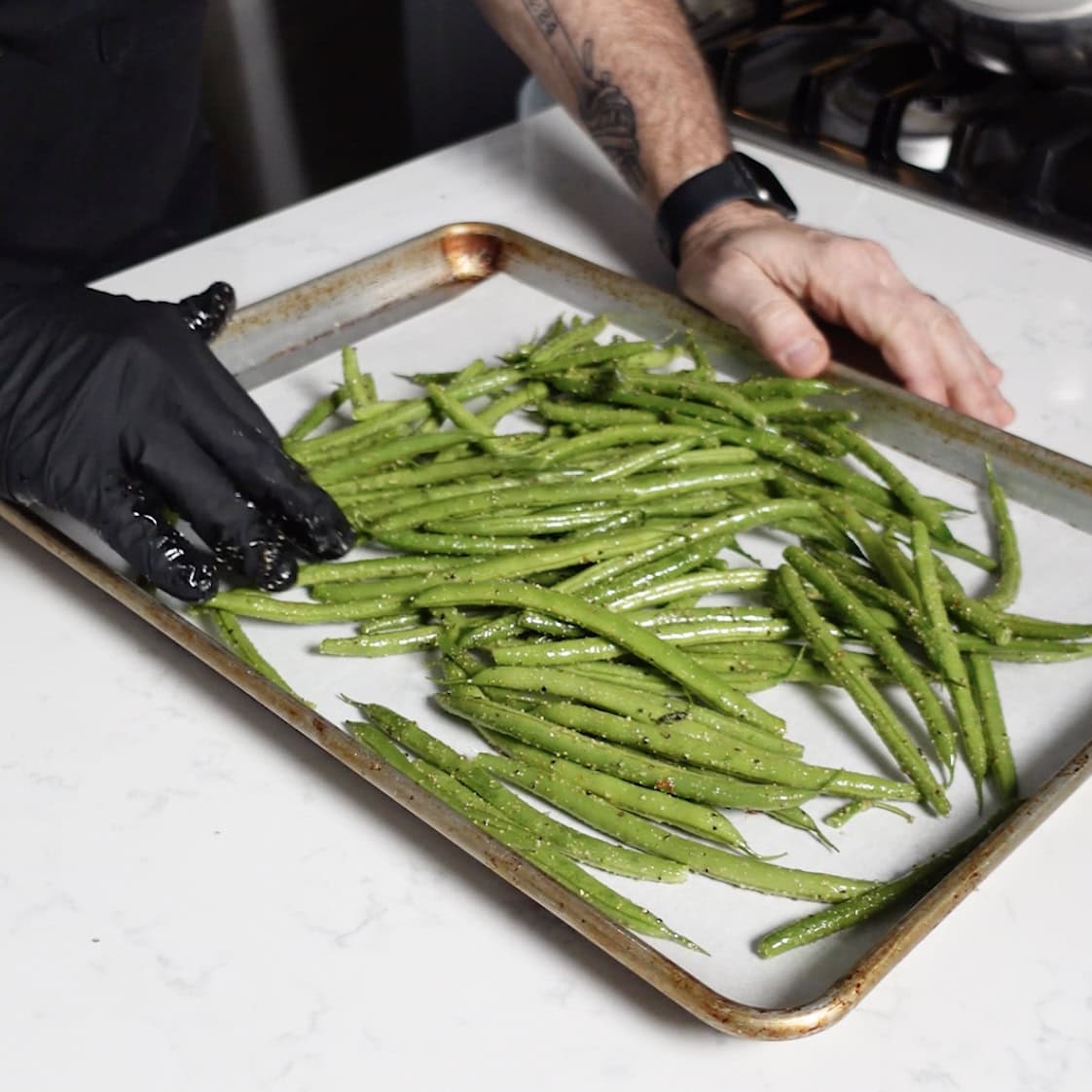 Green beans on a cooking sheet.