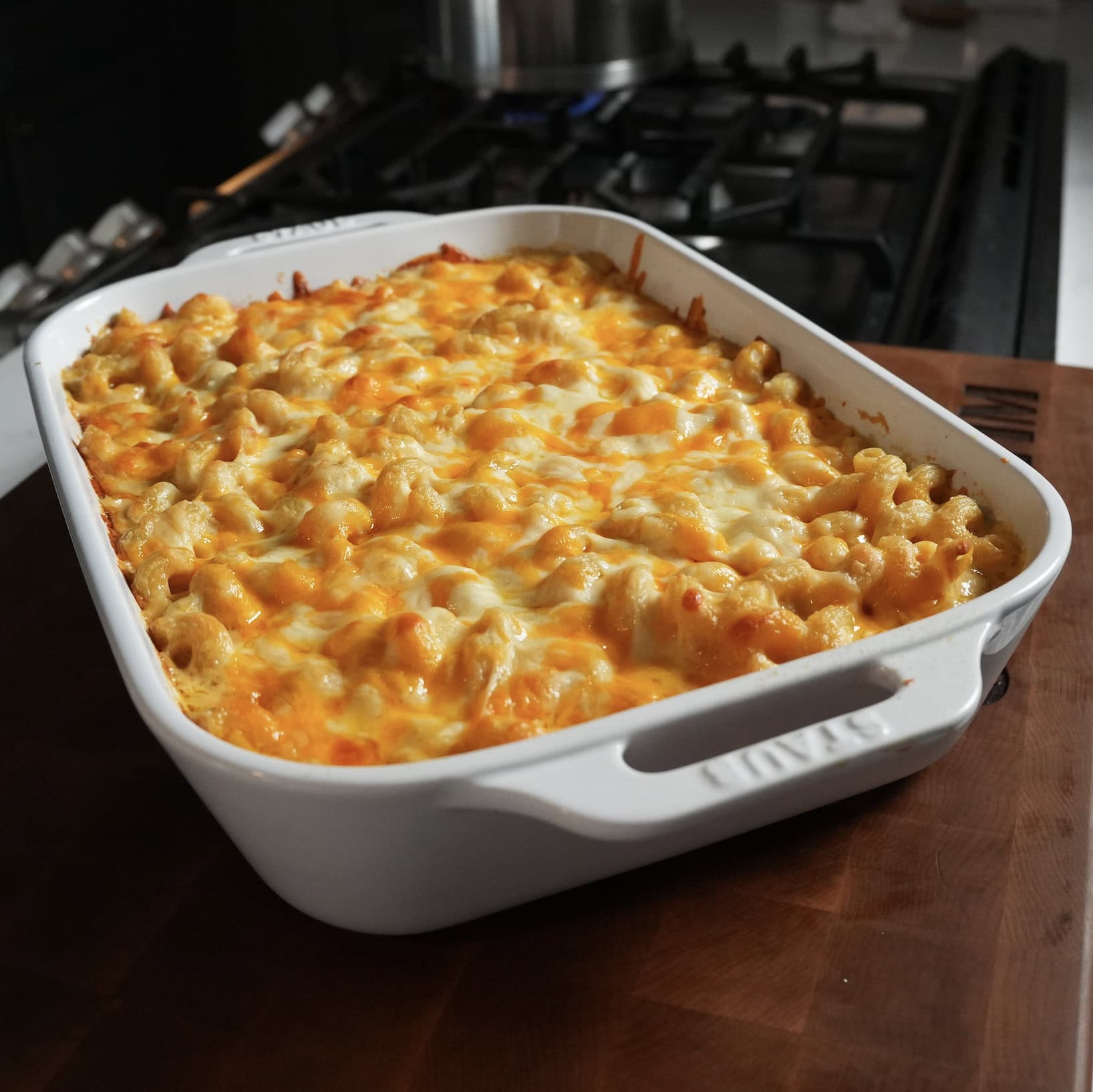 Mac and cheese in a white baking dish.