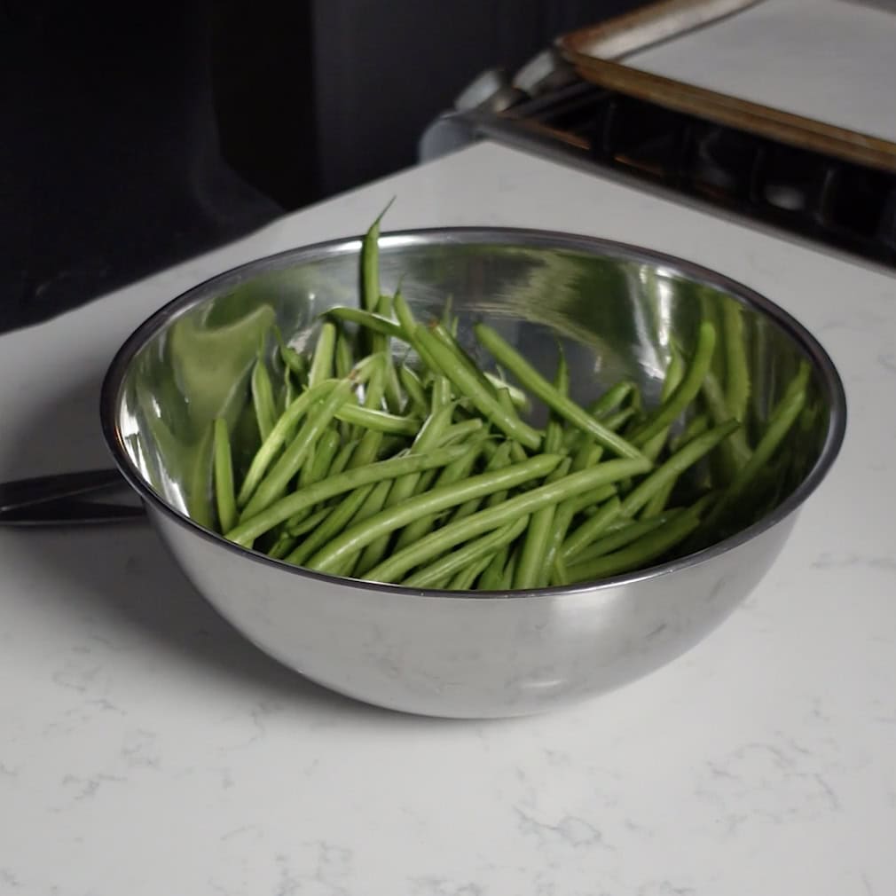 Green Beans in a mixing bowl.
