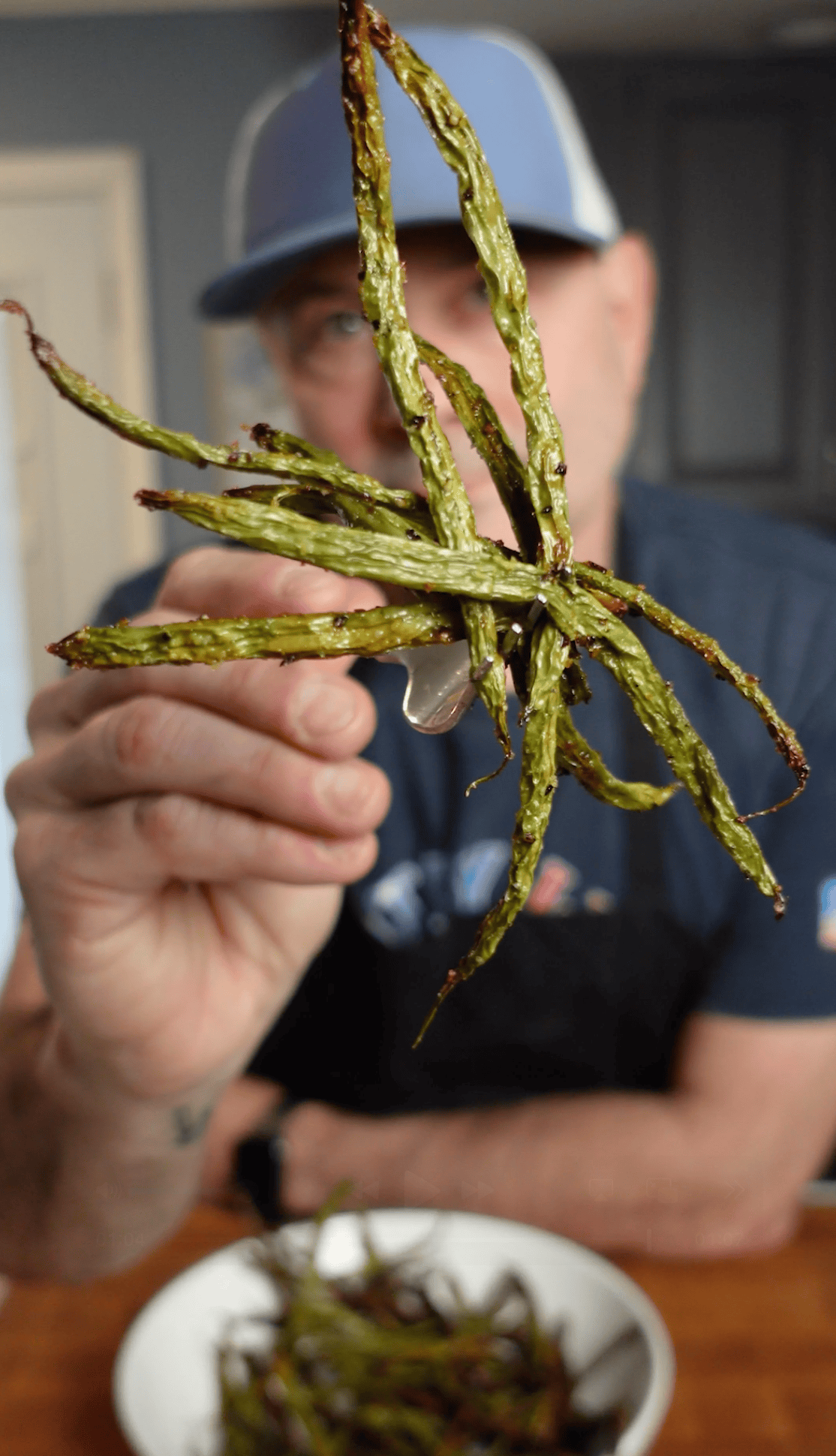 A fork full of crispy green beans.