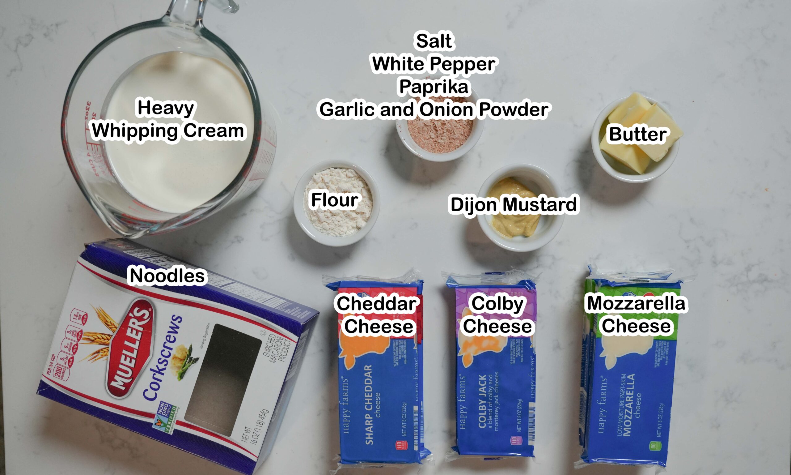 Mac n Cheese ingredients laid out on counter.