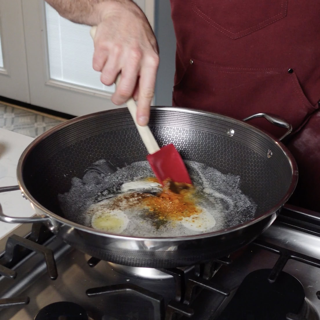 Combine roux ingredients into a skillet with spatula.