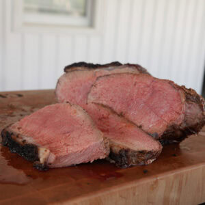 New York Strip Loin Roast cut into slices.