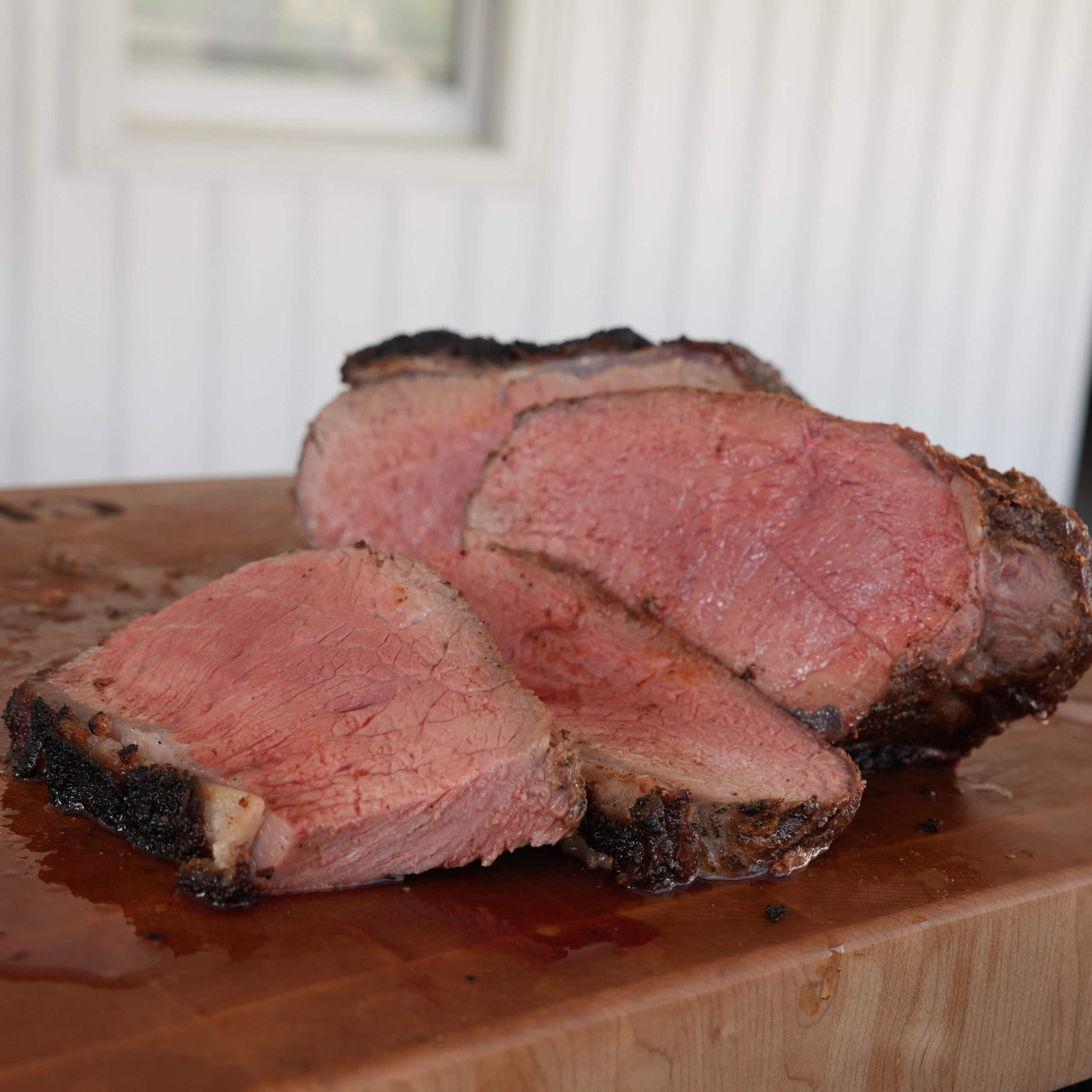 New York Strip Loin Roast cut into slices.