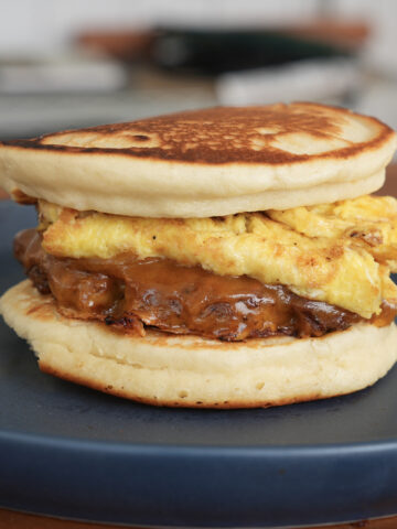 Sausage Egg and Cheese McGriddle on a blue plate.