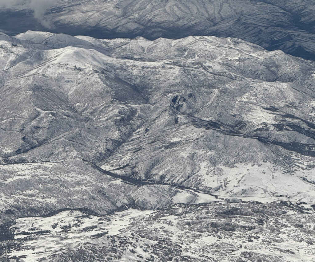 A view of mountains from an airplane.