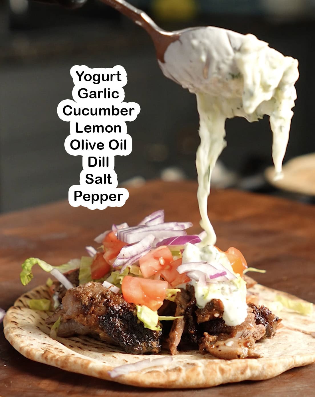 Ingredients for tzatziki Sauce being poured onto a gyro.