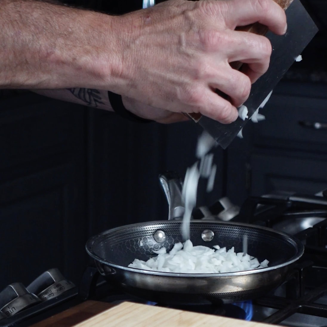 Cooking onion on a skillet.