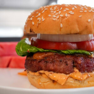 smoked hamburger with tomato and lettuce.