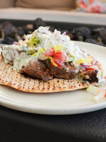 tzatziki Sauce Gyro on a white plate.