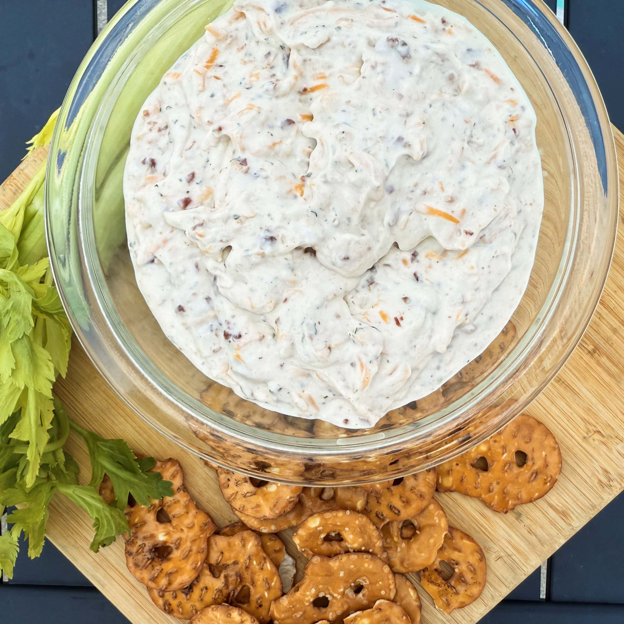 A ranch dip with pretzels and celery.
