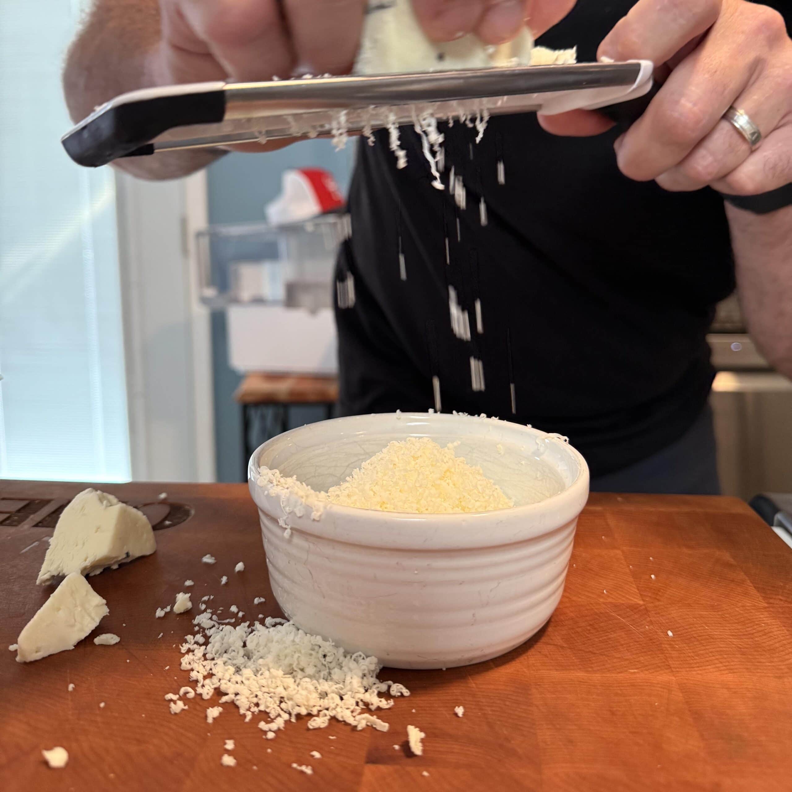 Shredded cheese in a dish.