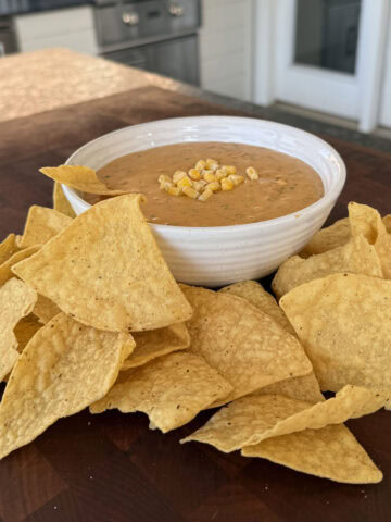 Corn queso dip with tortillas.