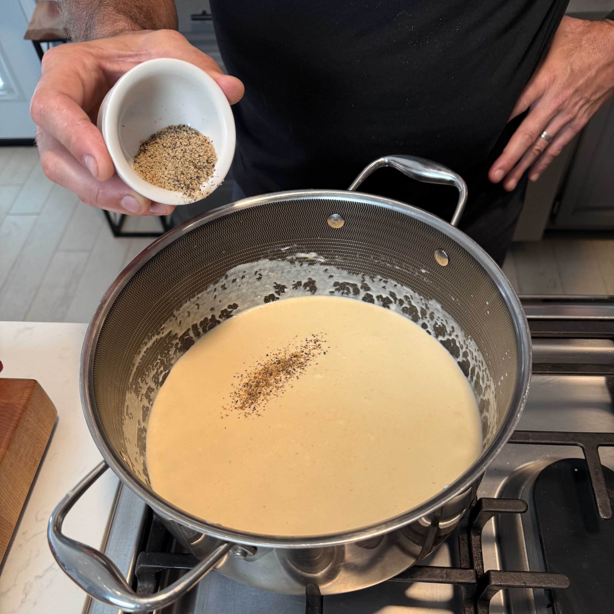 Seasoning going into a pot.