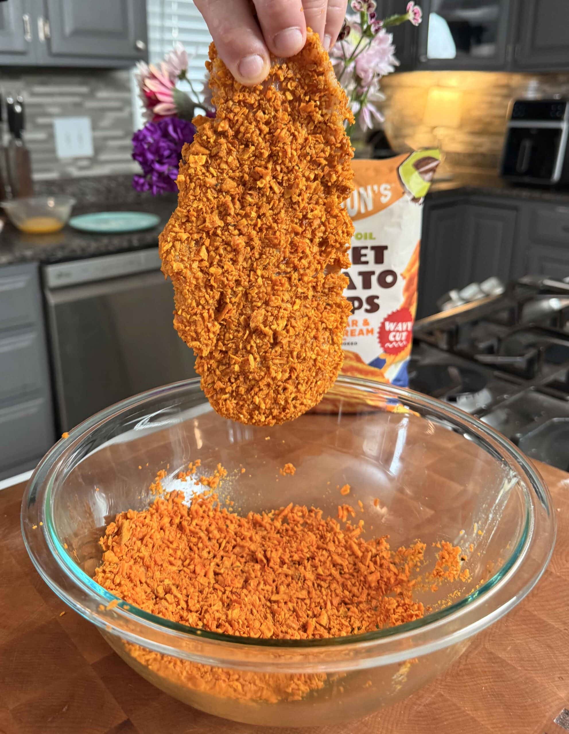 Chicken coated with bread crumbs.