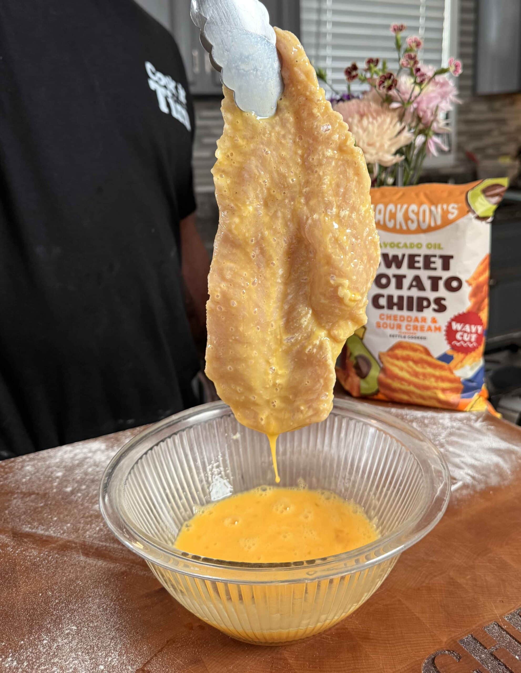 Chicken coated with egg wash.