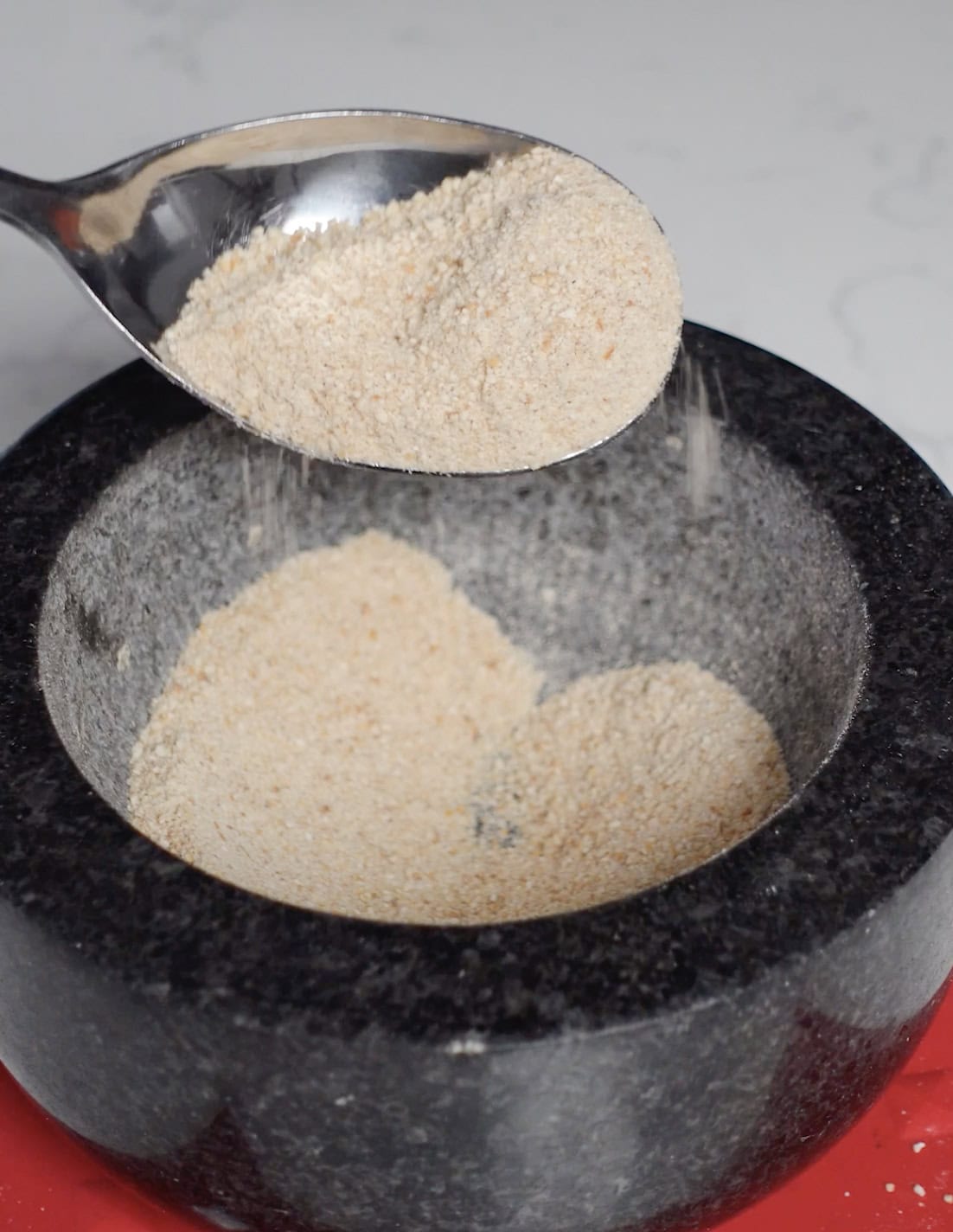 Ground rice in a mortar.