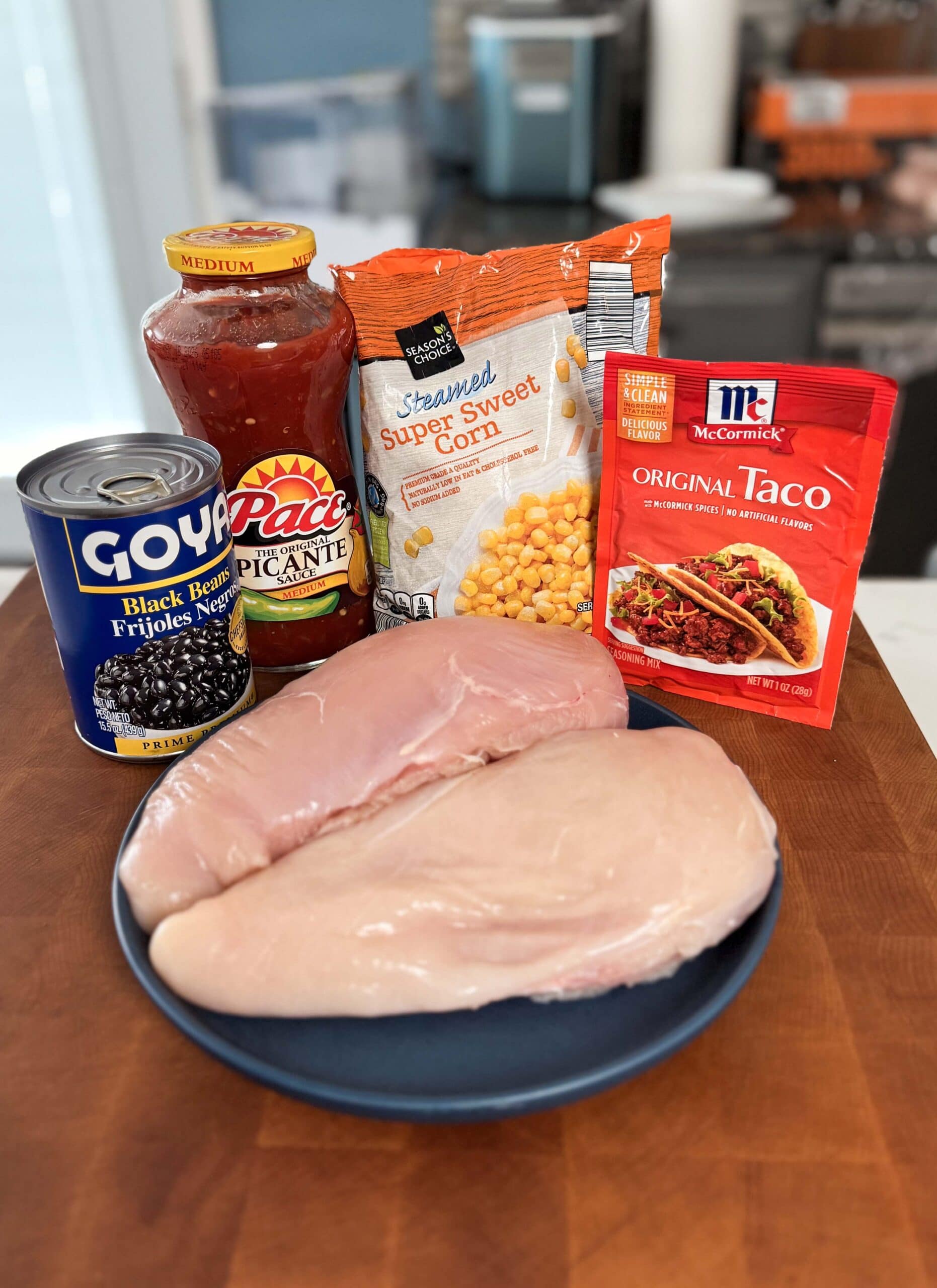 Ingredients for crockpot chicken tacos with salsa.