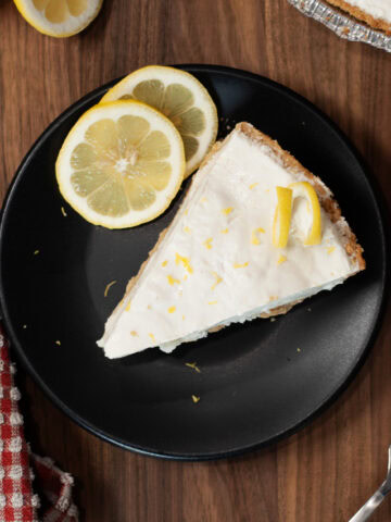 A slice of cheesecake with lemon.