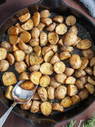 Roasted Rosemary Potatoes in a skillet.