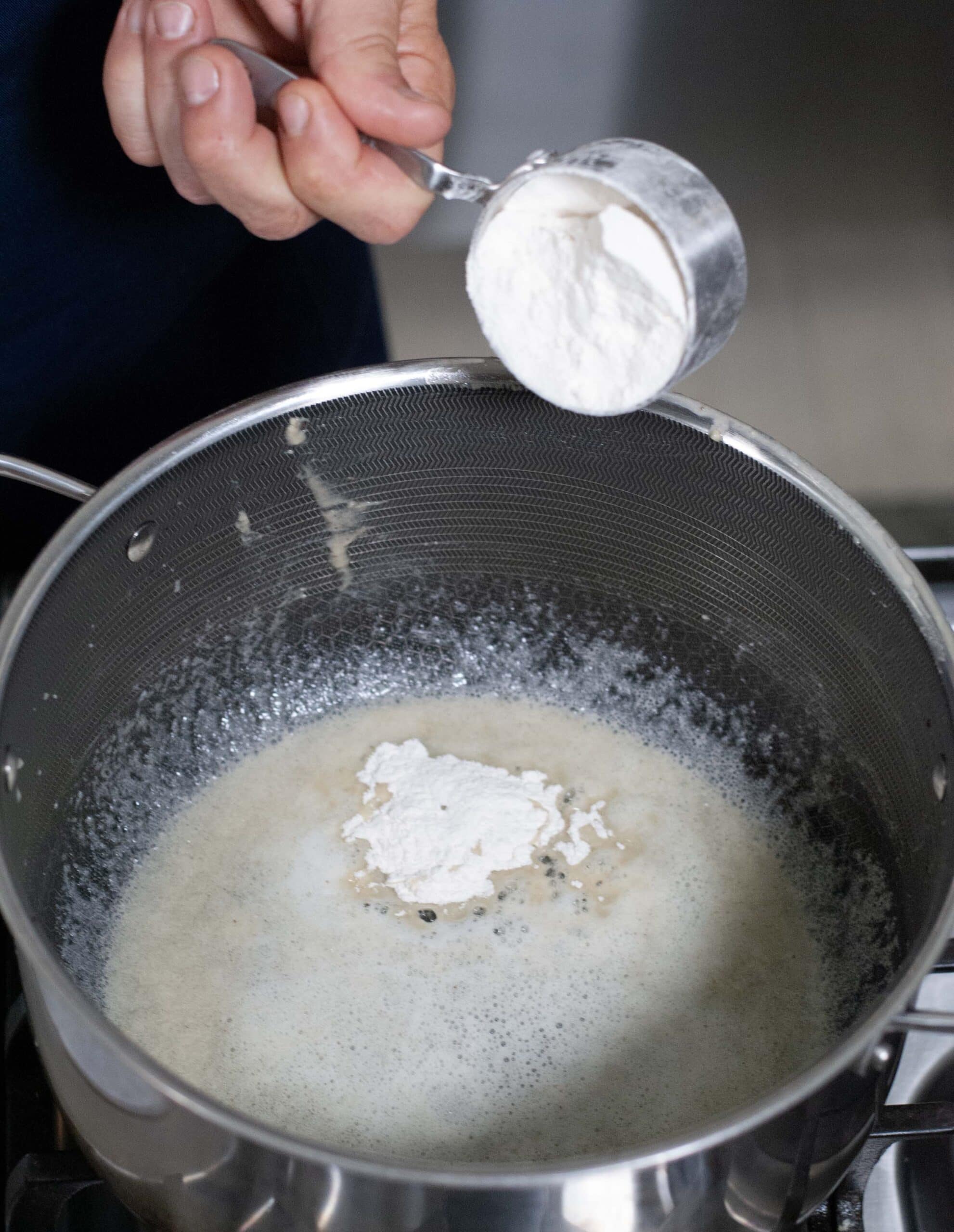 Flour mixing with butter and bacon fat.