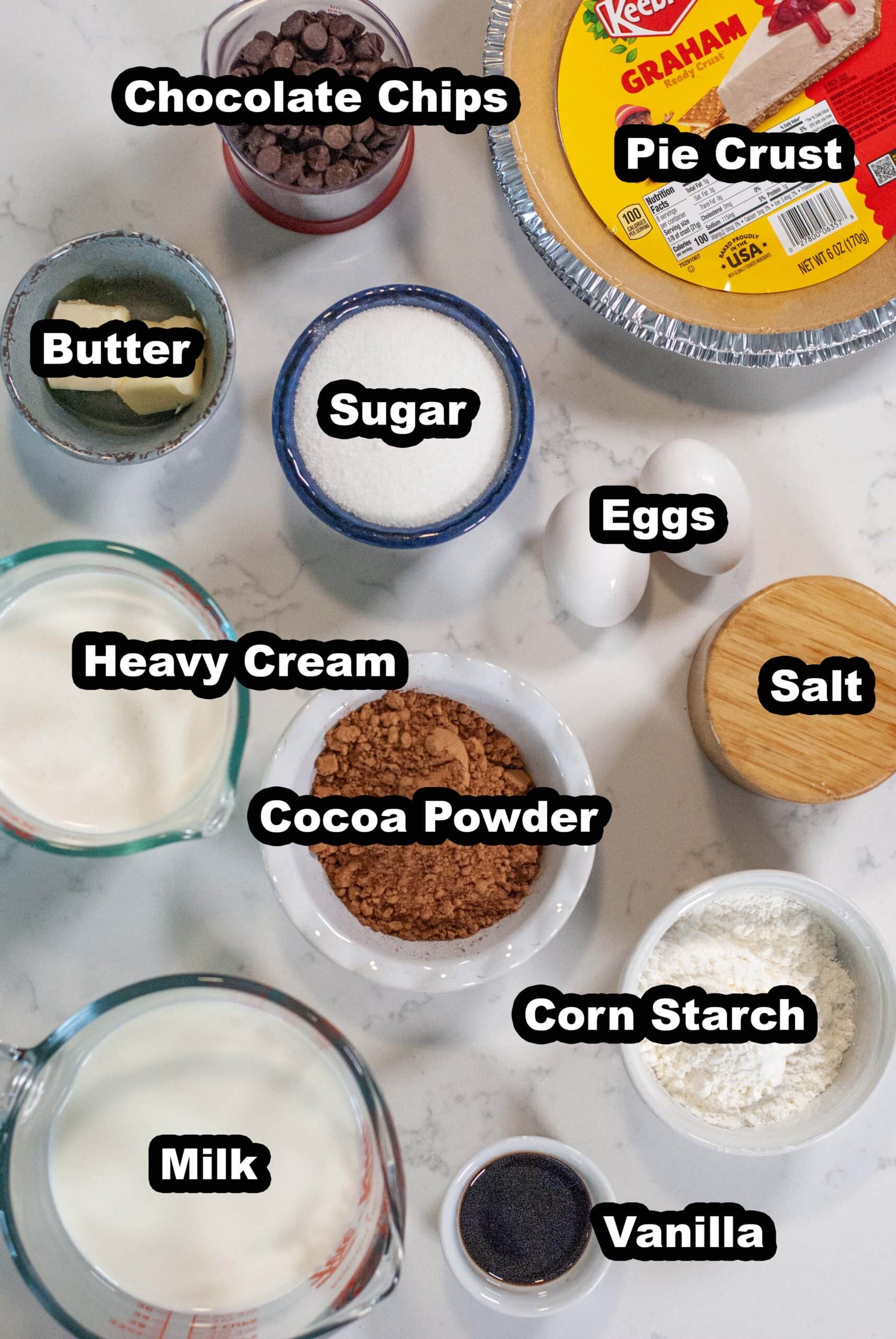 Ingredients for no-bake chocolate pie measured out in bowls.